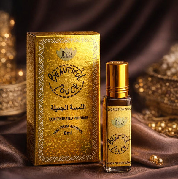 Gold 'Beautiful Touch' concentrated perfume bottle and packaging on a dark background