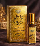 Gold 'Beautiful Touch' concentrated perfume bottle and packaging on a dark background