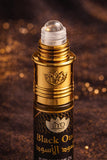 Black and gold 'Black Oud' perfume oil packaging with JYO branding on a dark background.