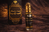Black Oud perfume bottle with packaging on a textured brown background